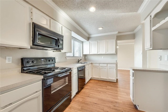 3610 Peakview Dr, Corinth, TX 76210 - kitchen with black appliances, a sink, a textured ceiling, crown molding, and white cabinetry
