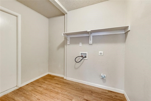 3610 Peakview Dr, Corinth, TX 76210 - laundry room with electric dryer hookup, washer hookup, light wood-style floors, and baseboards