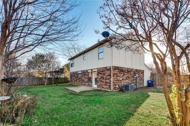 3610 Peakview Dr, Corinth, TX 76210 - view of side of home with board and batten siding, brick siding, a patio area, and cooling unit