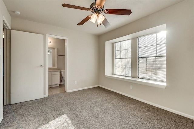 3610 Peakview Dr, Corinth, TX 76210 - unfurnished bedroom with carpet, baseboards, ensuite bathroom, and ceiling fan