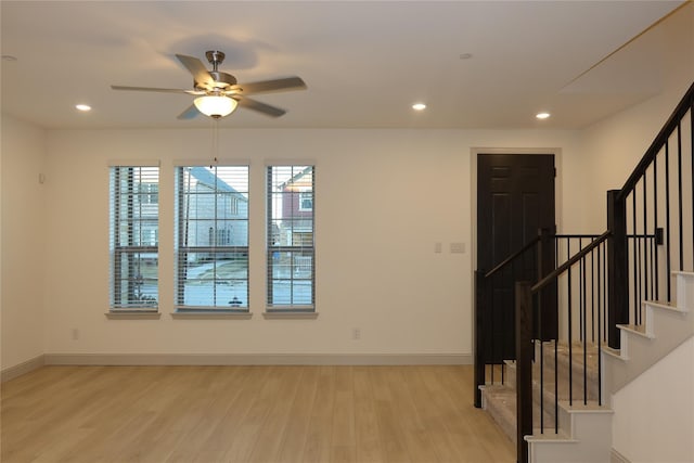 2538 Settlers Pl, Garland, TX 75042 - spare room featuring stairway, light wood-type flooring, a ceiling fan, baseboards, and recessed lighting