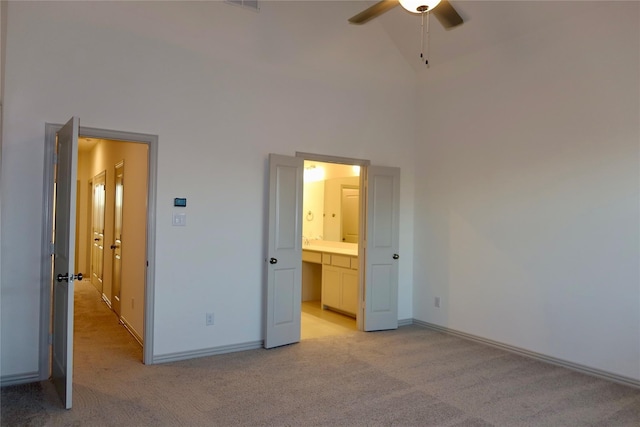 2538 Settlers Pl, Garland, TX 75042 - unfurnished bedroom featuring light carpet, a high ceiling, ensuite bath, and baseboards
