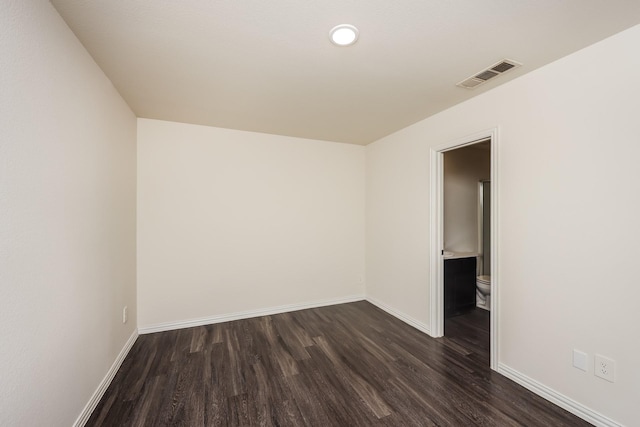 2829 Oakdale St, Dallas, TX 75215 - empty room with dark wood-type flooring and baseboards