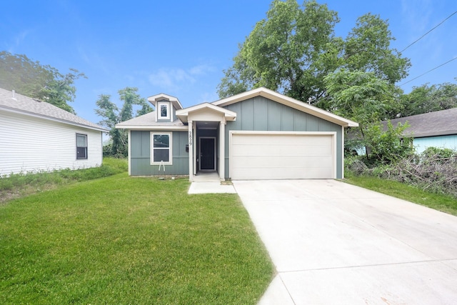 2829 Oakdale St, Dallas, TX 75215 - view of front of home featuring board and batten siding, an attached garage, a front lawn, and concrete driveway