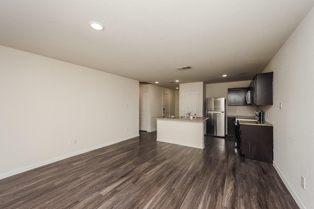2829 Oakdale St, Dallas, TX 75215 - unfurnished living room featuring dark wood-style floors, baseboards, and recessed lighting