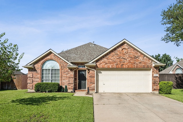 10119 Andre Dr, Irving, TX 75063 - view of front facade with concrete driveway, a garage, brick siding, and a shingled roof