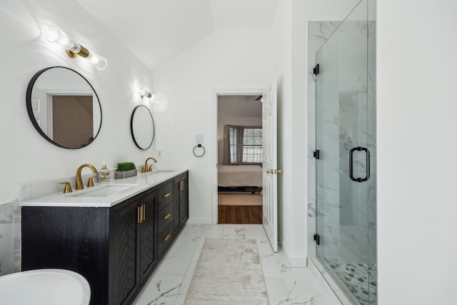 10119 Andre Dr, Irving, TX 75063 - ensuite bathroom with marble look tiles, a marble finish shower, double vanity, lofted ceiling, and baseboards