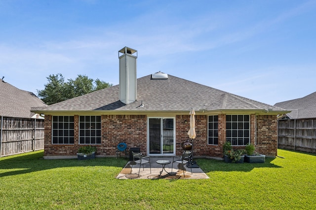 10119 Andre Dr, Irving, TX 75063 - rear view of property featuring brick siding, a chimney, a patio area, and roof with shingles