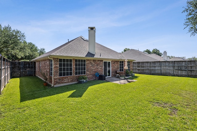 10119 Andre Dr, Irving, TX 75063 - back of house with brick siding, a chimney, a patio area, and roof with shingles