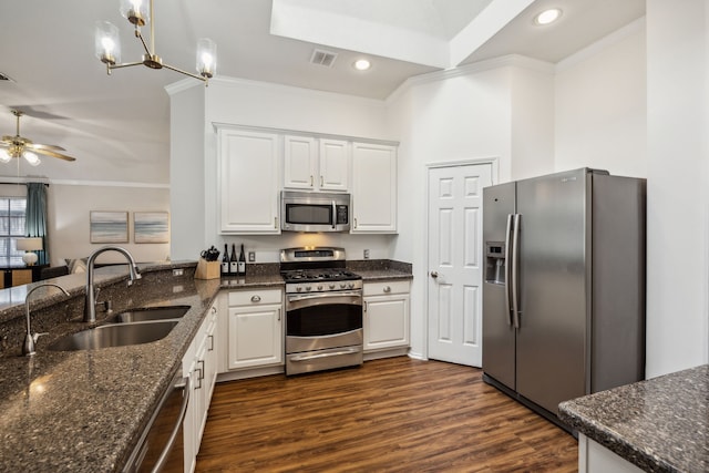10119 Andre Dr, Irving, TX 75063 - kitchen featuring stainless steel appliances, ornamental molding, a sink, white cabinetry, and recessed lighting