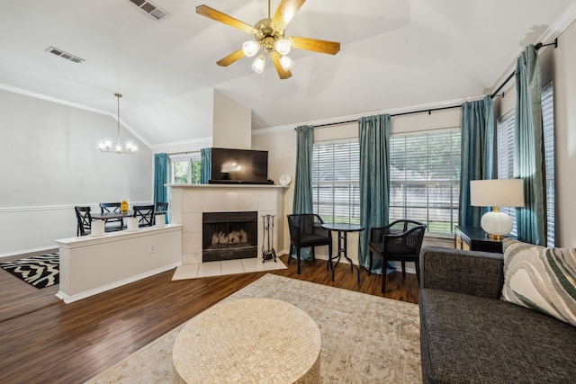 10119 Andre Dr, Irving, TX 75063 - living area with lofted ceiling, wood finished floors, ornamental molding, a chandelier, and a ceiling fan