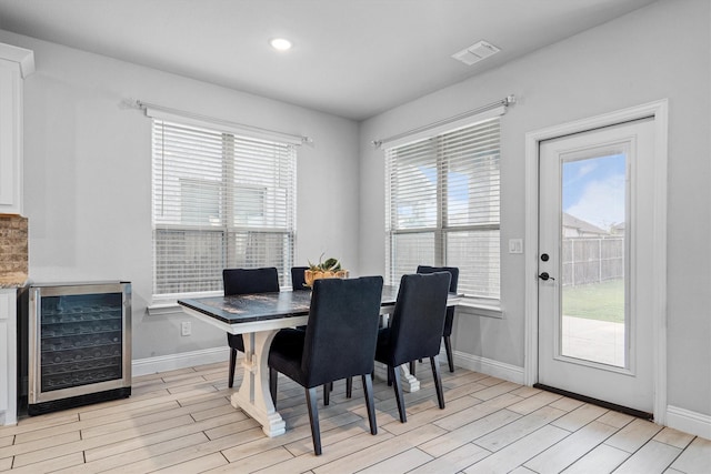 1417 Stoneleigh Pl, Aubrey, TX 76227 - dining room featuring wine cooler, light wood-type flooring, baseboards, and recessed lighting