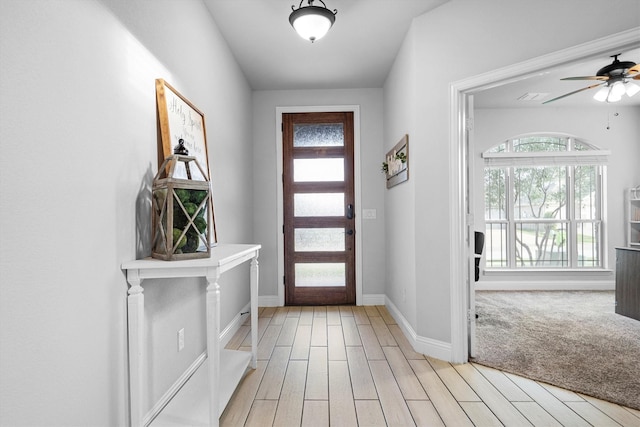 1417 Stoneleigh Pl, Aubrey, TX 76227 - foyer entrance featuring plenty of natural light, light wood-style floors, a ceiling fan, and baseboards