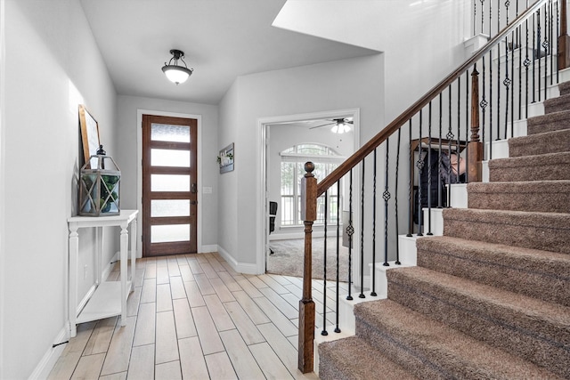 1417 Stoneleigh Pl, Aubrey, TX 76227 - entrance foyer with stairs, baseboards, light wood-style floors, and ceiling fan