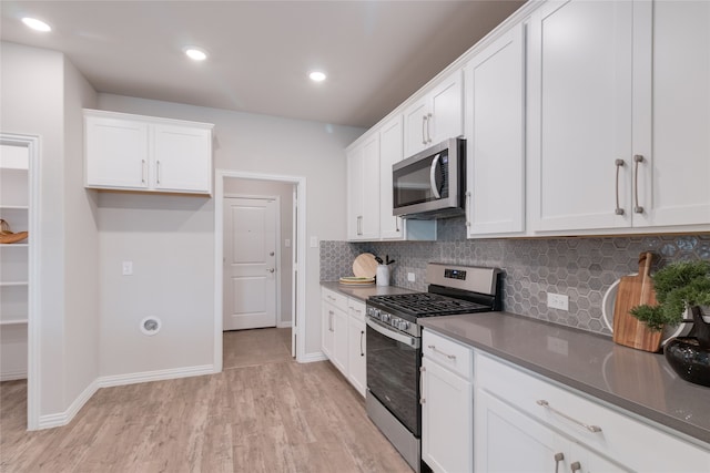 1616 Berry Ridge Trl, Aubrey, TX 76227 - kitchen with stainless steel appliances, backsplash, white cabinetry, light wood finished floors, and recessed lighting