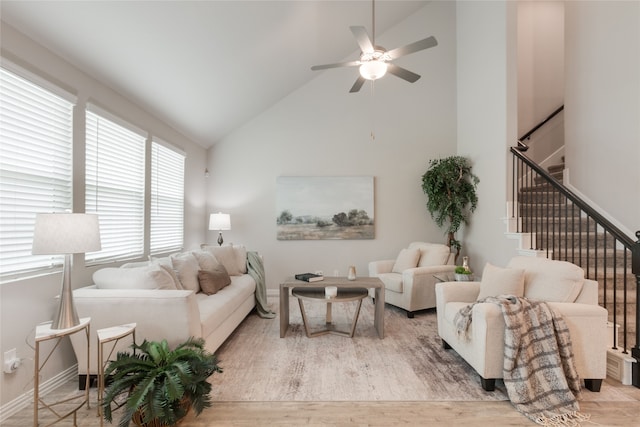 1616 Berry Ridge Trl, Aubrey, TX 76227 - living room with ceiling fan, high vaulted ceiling, baseboards, light wood-style flooring, and stairway