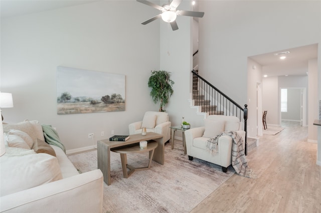 1616 Berry Ridge Trl, Aubrey, TX 76227 - living area with a high ceiling, stairway, wood finished floors, ceiling fan, and baseboards