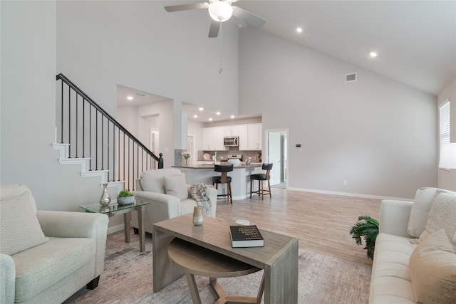 1616 Berry Ridge Trl, Aubrey, TX 76227 - living room featuring high vaulted ceiling, light wood finished floors, ceiling fan, baseboards, and recessed lighting