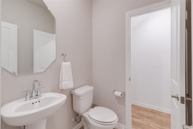 1616 Berry Ridge Trl, Aubrey, TX 76227 - bathroom with a sink, toilet, wood finished floors, and baseboards