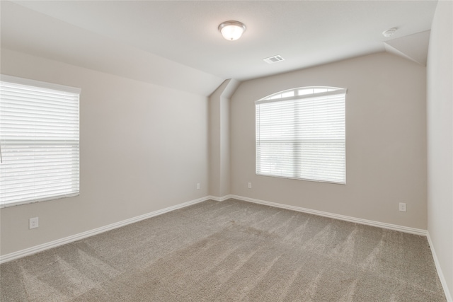 1616 Berry Ridge Trl, Aubrey, TX 76227 - spare room featuring lofted ceiling, carpet floors, and baseboards