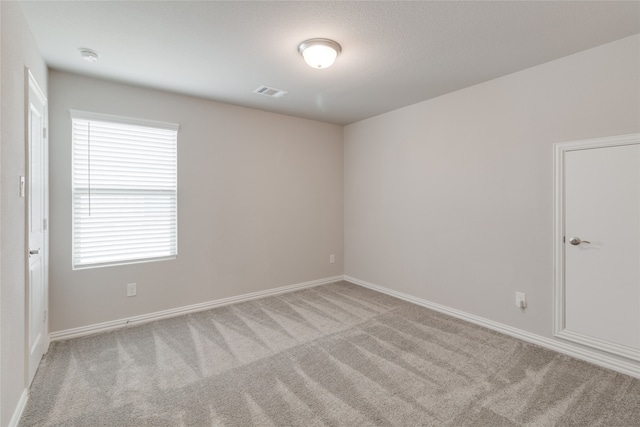 1616 Berry Ridge Trl, Aubrey, TX 76227 - empty room featuring carpet floors, baseboards, and a smoke detector