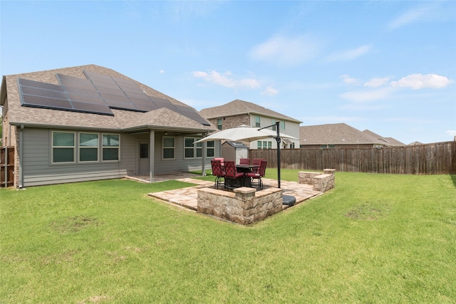 1616 Berry Ridge Trl, Aubrey, TX 76227 - back of property featuring solar panels, a patio area, and roof with shingles