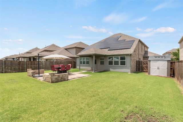 1616 Berry Ridge Trl, Aubrey, TX 76227 - rear view of property with solar panels, a patio, and roof with shingles