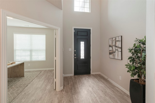 1616 Berry Ridge Trl, Aubrey, TX 76227 - foyer entrance featuring light wood-style floors, baseboards, and a high ceiling