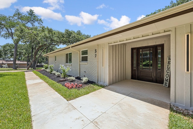 37 Devonshire Dr, Bedford, TX 76021 - view of exterior entry featuring brick siding