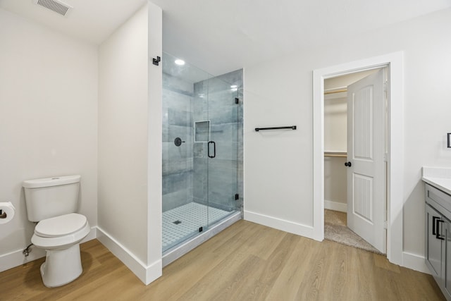 37 Devonshire Dr, Bedford, TX 76021 - full bathroom featuring wood finished floors, vanity, baseboards, a stall shower, and recessed lighting