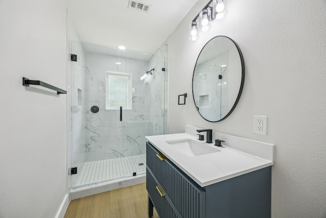 37 Devonshire Dr, Bedford, TX 76021 - full bath featuring a marble finish shower, vanity, and wood finished floors