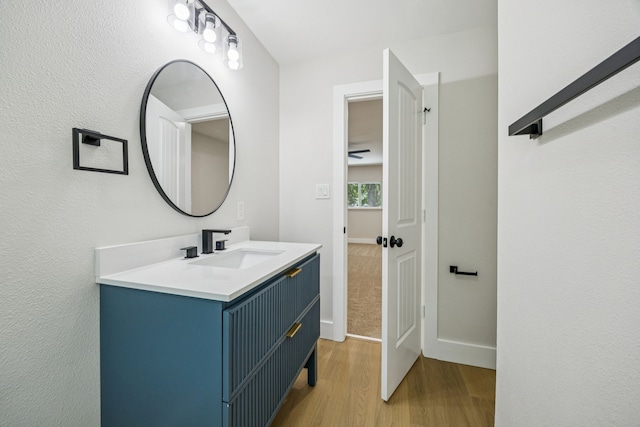 37 Devonshire Dr, Bedford, TX 76021 - bathroom featuring wood finished floors, baseboards, and vanity