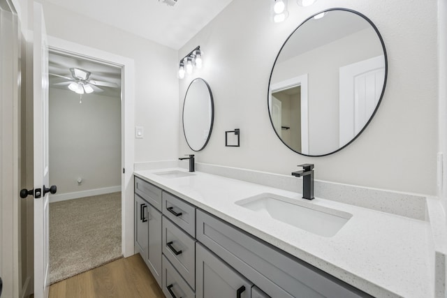 37 Devonshire Dr, Bedford, TX 76021 - bathroom featuring double vanity, a ceiling fan, and wood finished floors