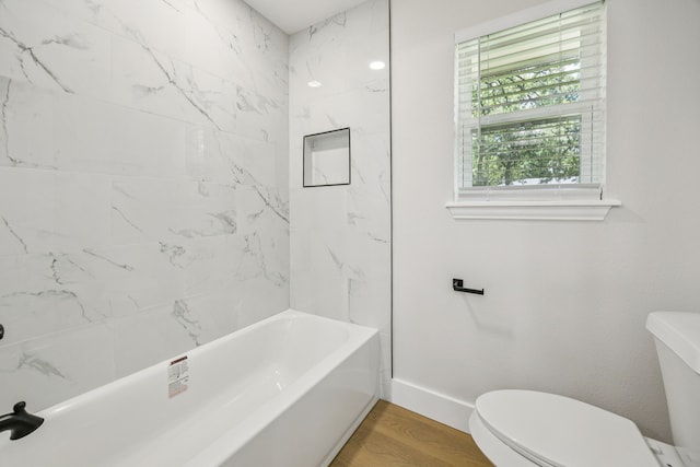 37 Devonshire Dr, Bedford, TX 76021 - full bathroom featuring toilet, baseboards, wood finished floors, and tub / shower combination