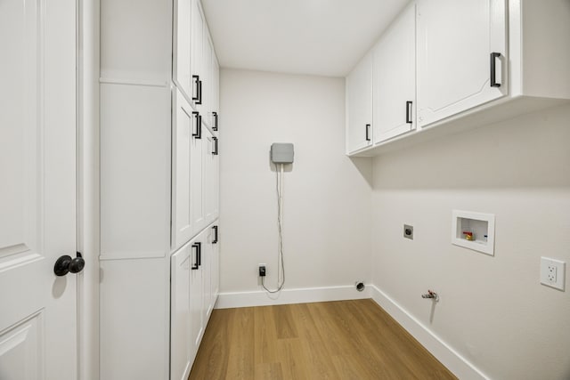 37 Devonshire Dr, Bedford, TX 76021 - laundry room with light wood-style flooring, cabinet space, baseboards, hookup for a gas dryer, and washer hookup