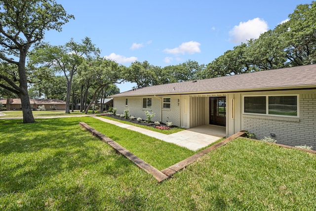 37 Devonshire Dr, Bedford, TX 76021 - rear view of house featuring brick siding, a yard, and roof with shingles