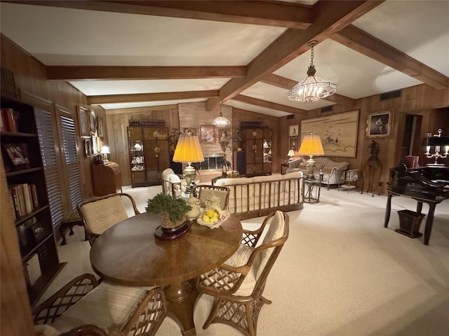 905 Bennett Dr, Bowie, TX 76230 - dining space with wooden walls, a chandelier, and carpet floors