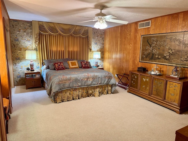 905 Bennett Dr, Bowie, TX 76230 - bedroom featuring carpet, wood walls, and wallpapered walls