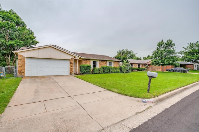423 Parkview Dr, Burleson, TX 76028 - view of front of property featuring brick siding, a garage, driveway, a front lawn, and a gate