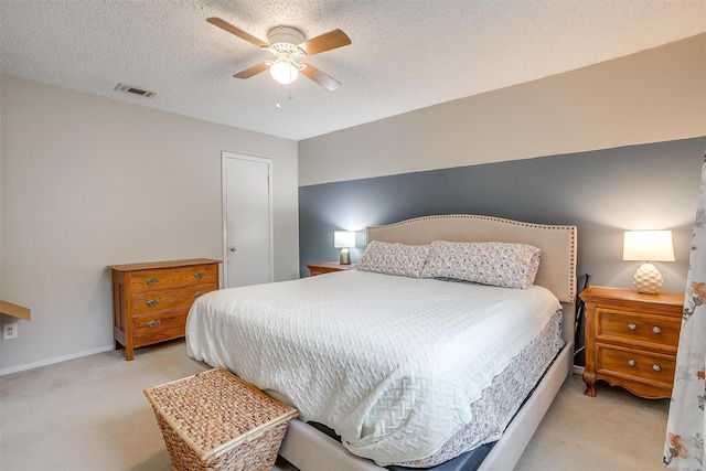 423 Parkview Dr, Burleson, TX 76028 - bedroom featuring light colored carpet, a textured ceiling, and ceiling fan