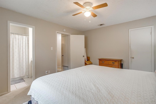 423 Parkview Dr, Burleson, TX 76028 - bedroom with light tile patterned flooring, light carpet, and a ceiling fan