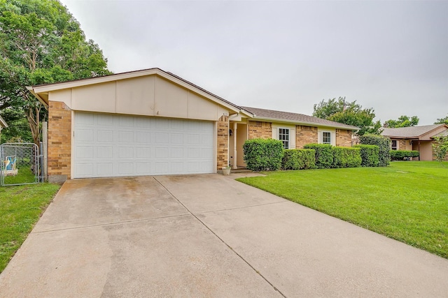 423 Parkview Dr, Burleson, TX 76028 - view of front of house featuring driveway, a garage, and brick siding