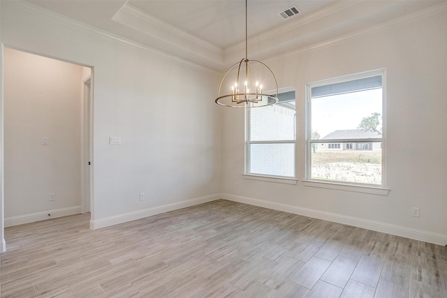 823 Wind River Pass, Azle, TX 76020 - spare room featuring healthy amount of natural light, a chandelier, crown molding, light wood finished floors, and a raised ceiling