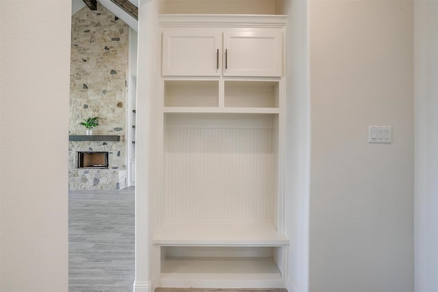 823 Wind River Pass, Azle, TX 76020 - mudroom with a stone fireplace and wood finished floors