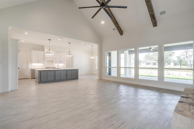 823 Wind River Pass, Azle, TX 76020 - unfurnished living room featuring a ceiling fan, high vaulted ceiling, healthy amount of natural light, a sink, and recessed lighting