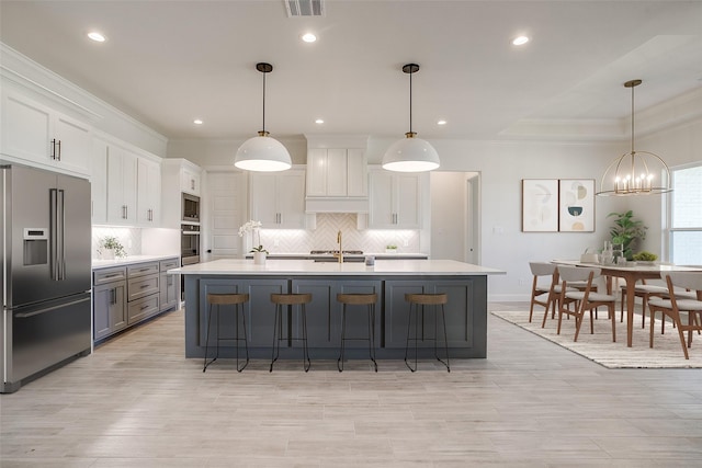 823 Wind River Pass, Azle, TX 76020 - kitchen featuring appliances with stainless steel finishes, decorative backsplash, light countertops, ornamental molding, and white cabinetry