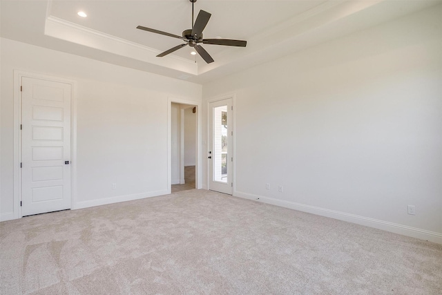 823 Wind River Pass, Azle, TX 76020 - spare room with a raised ceiling, a ceiling fan, light colored carpet, recessed lighting, and ornamental molding