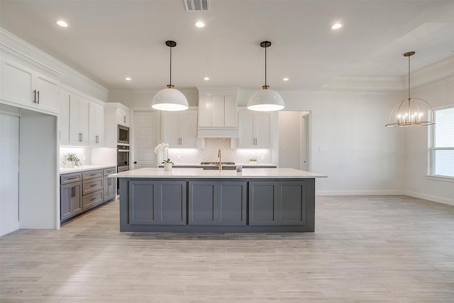 823 Wind River Pass, Azle, TX 76020 - kitchen featuring appliances with stainless steel finishes, light countertops, gray cabinetry, white cabinetry, and crown molding
