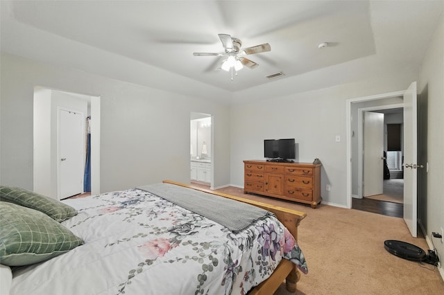 6701 Ridgetop Rd, North Richland Hills, TX 76182 - carpeted bedroom featuring a raised ceiling, a ceiling fan, and ensuite bath