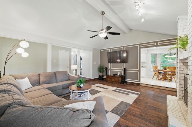 6701 Ridgetop Rd, North Richland Hills, TX 76182 - living room featuring wood finished floors, ceiling fan, and a decorative wall